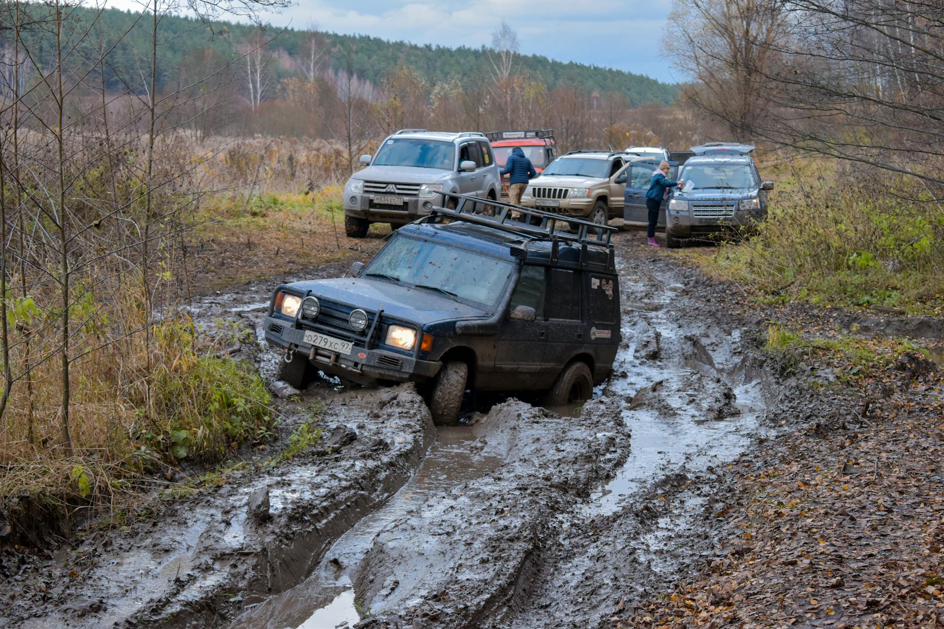 car stuck on muddy road